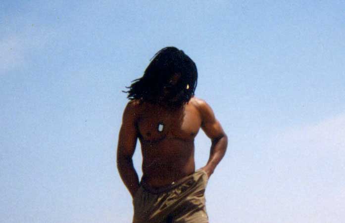Izmskzm walking on beach.